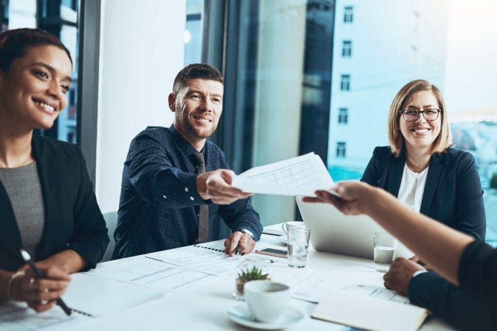 Image showing key stakeholders involved in creating an annual report, from executives to legal teams.